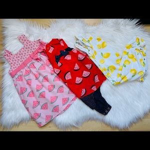 1 dress 1 onesie and 1 roper. Size 18 Months. 2 pieces made by Carter’s and 1 RR